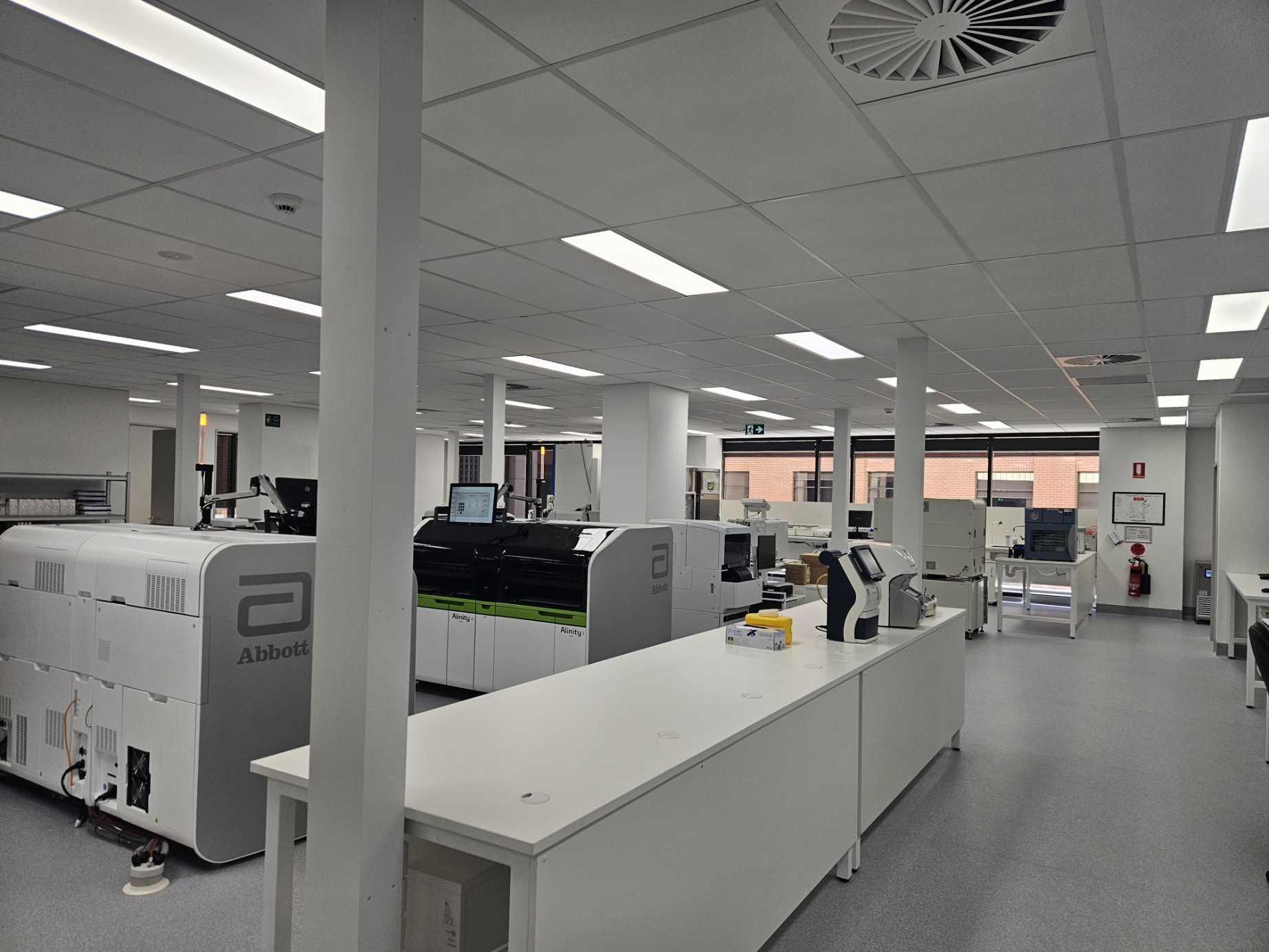 Smoke and heat detection system installed in a clean room with white walls and tables at Hollywood Hospital, Clinipath Tenancy